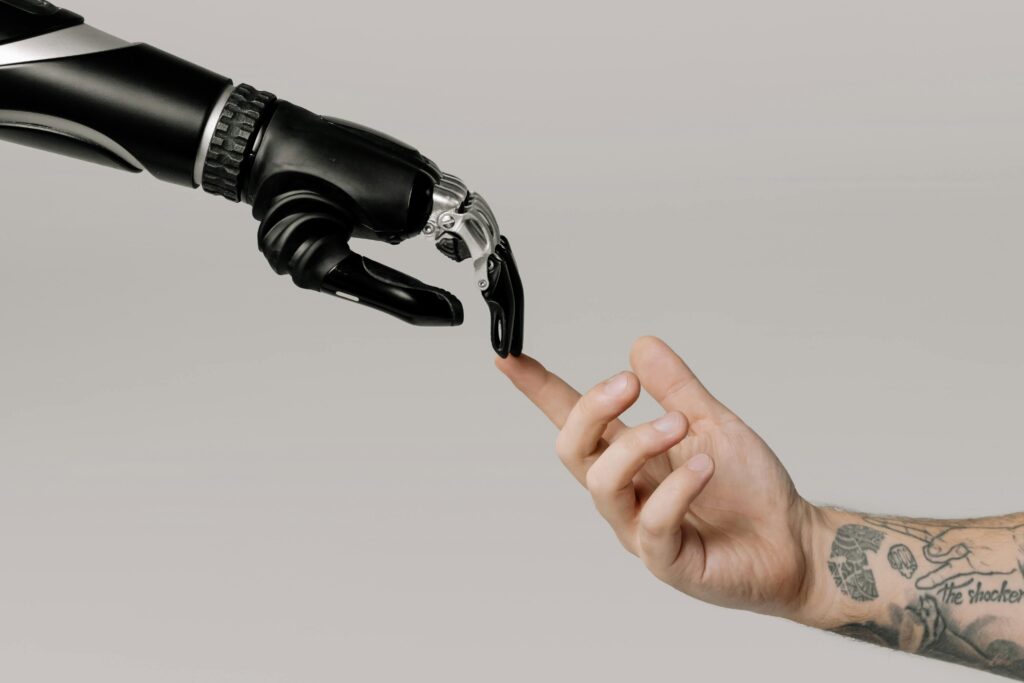 Ai-Powered Design two hands touching fingers one is robotic and another is human hand